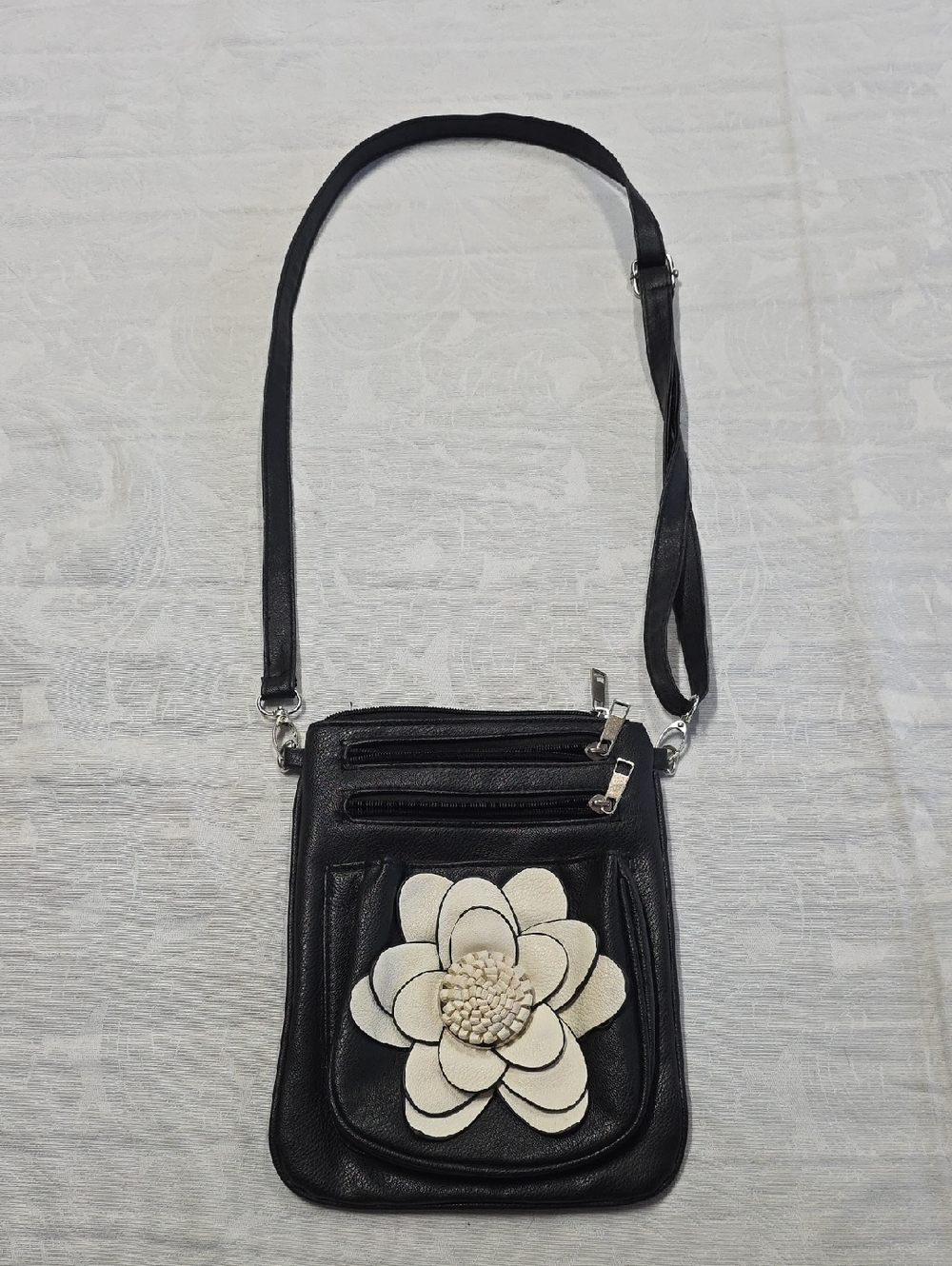 Black Crossbody Bag with White Floral Accent